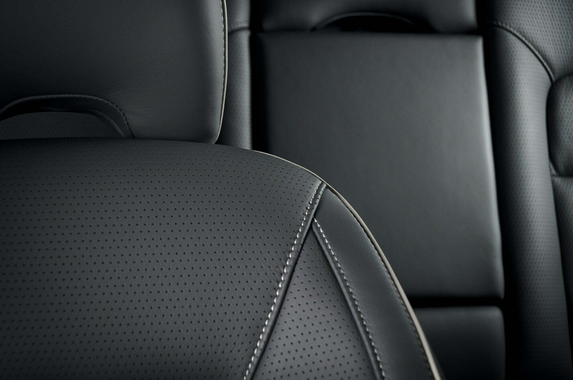 Modern sport car black leather interior. Part of leather car seat details.