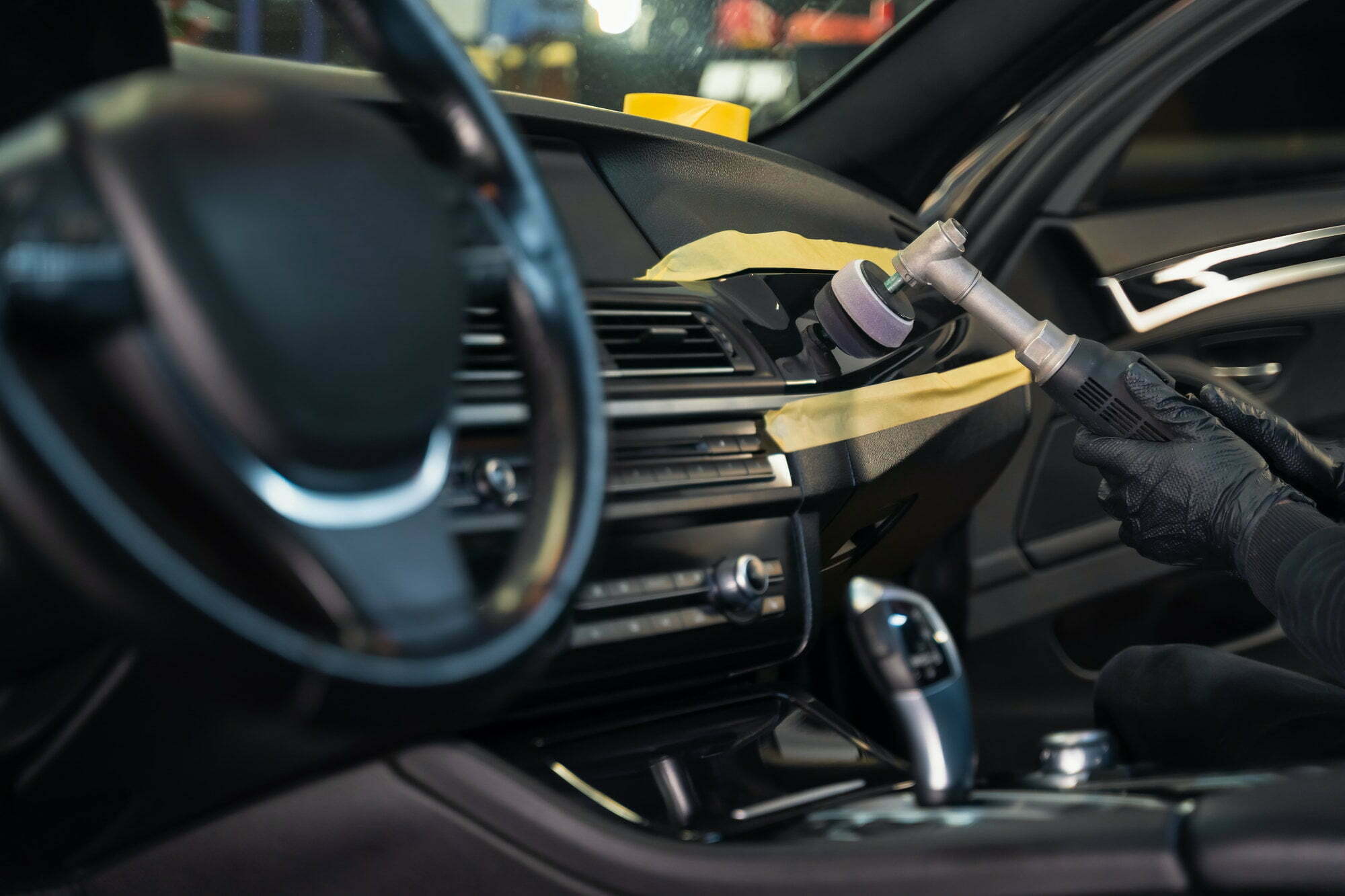 Professional polishing car interior trim. Auto detailing concept